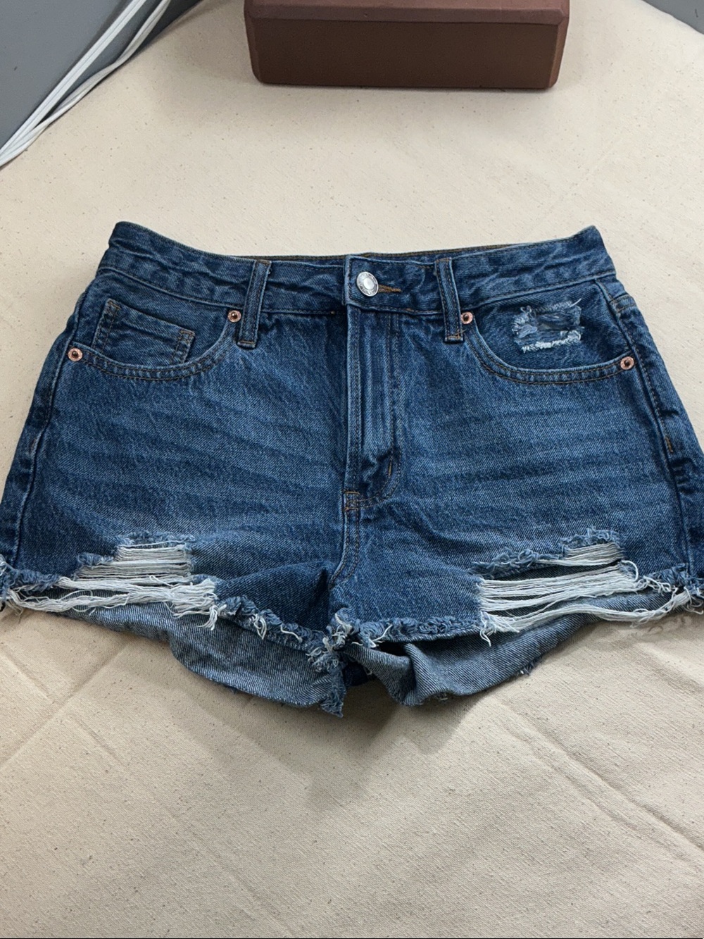 High-Rise Ripped Denim Shorts in Dark Blue